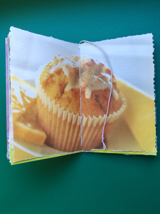 Centre pages of junk journal with a printed image of a muffin