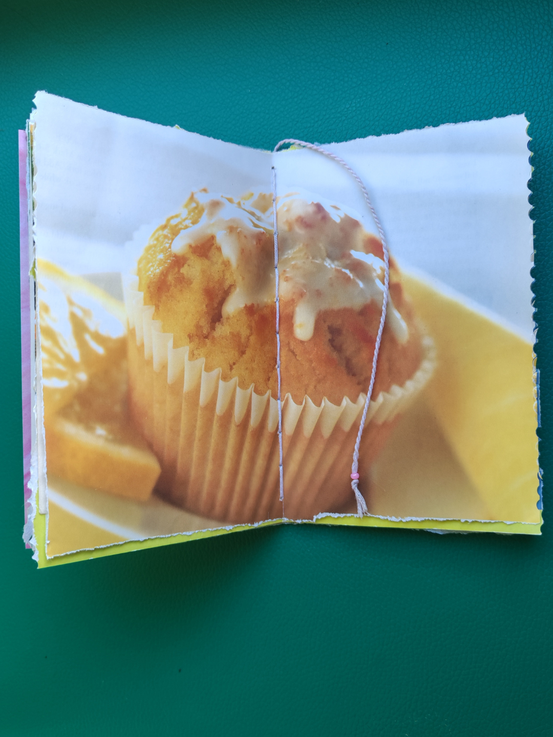 Centre pages of junk journal with a printed image of a muffin
