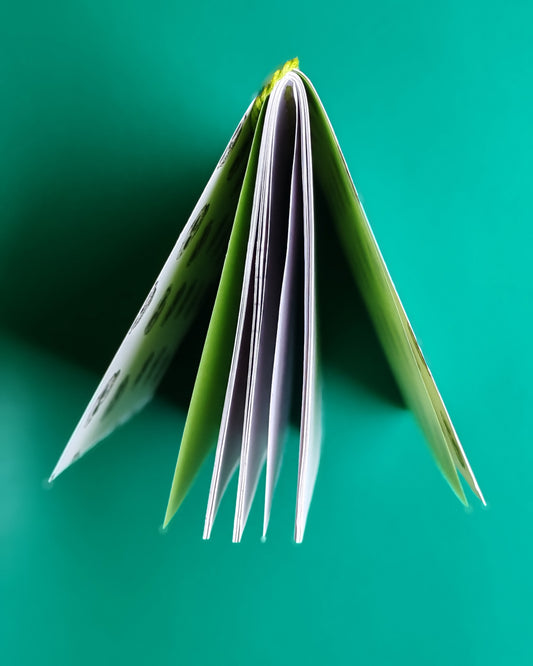Top view of notebook standing open on a desk