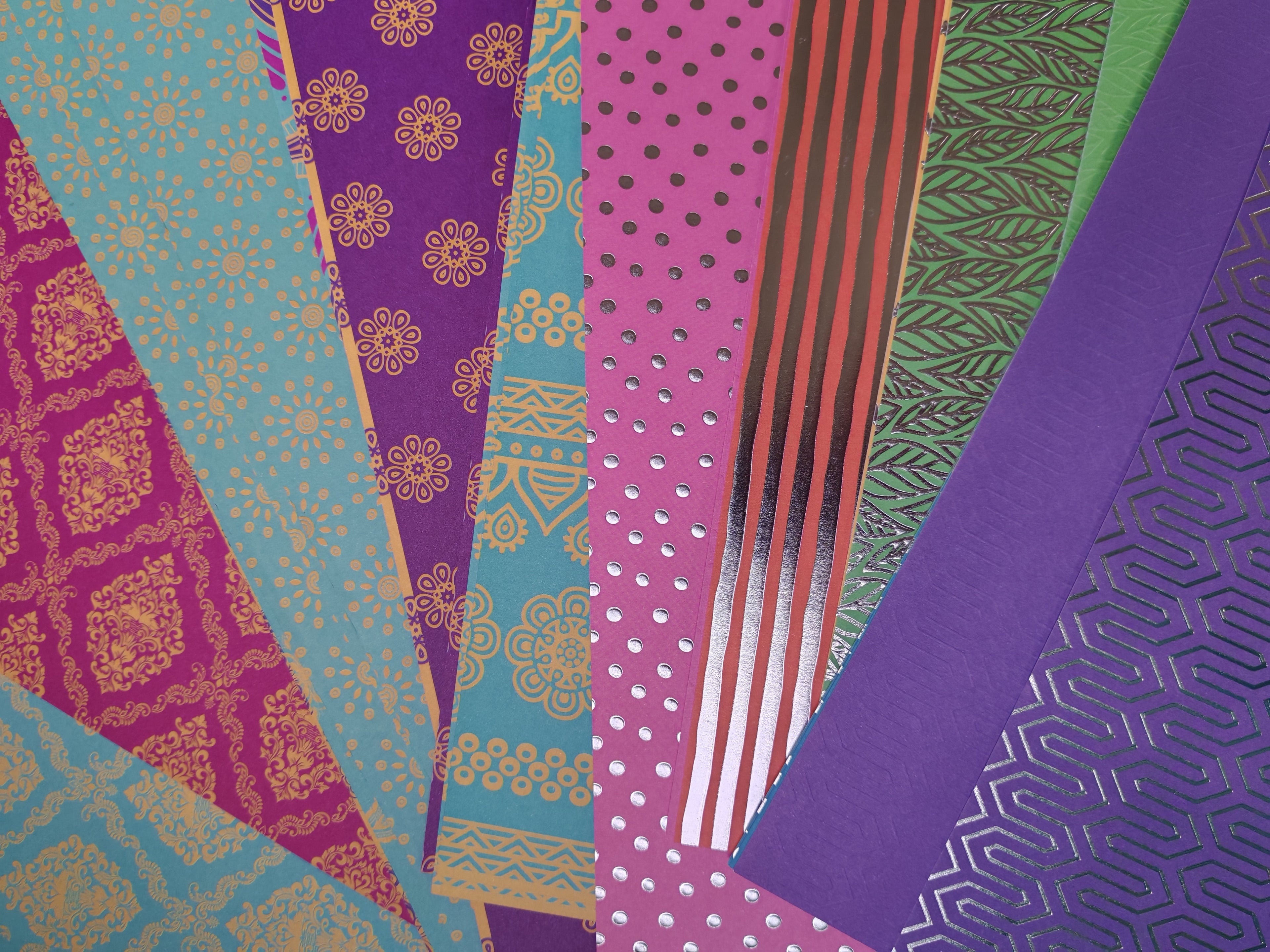 Collection of colorful patterned paper sheets